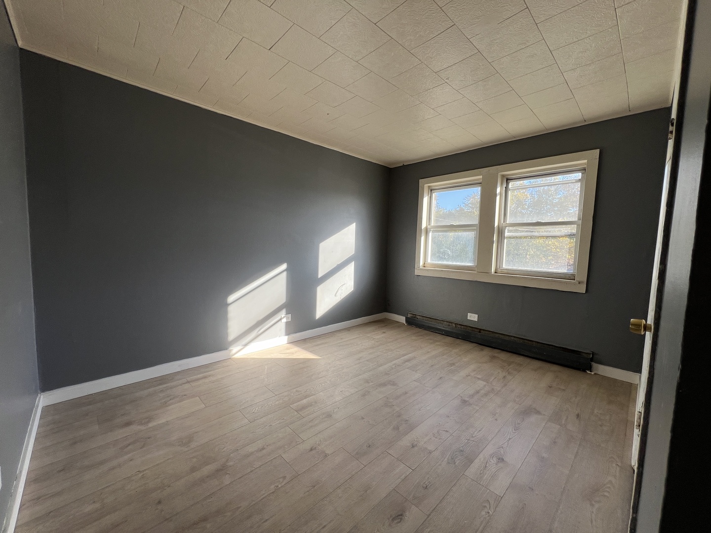 5305 South 72nd Court, Unit 4 Summit, IL 60501 - Photo 6 of 17 an empty room with windows