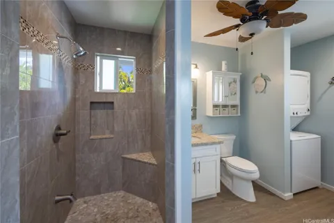 a bathroom with a toilet a sink and shower