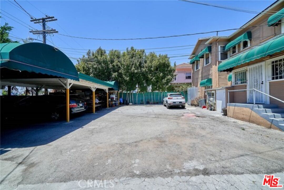 1023 South Wilton Place Los Angeles, CA 90019 - Photo 8 of 34 a car parked on the side of a street