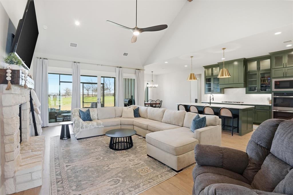 6620 Buffalo Ridge Circle Godley, TX 76044 - Photo 8 of 40 a living room with furniture kitchen view and a large window