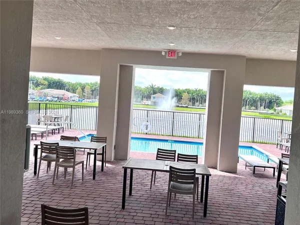 a view of swimming pool with a yard in the back