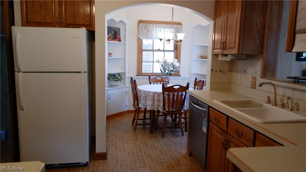 4181 Bushnell Road University Heights, OH 44118 - Photo 10 of 22 Plenty of cabinets and countertops for your food preparation. Double porcelain sink with tiled backsplash.