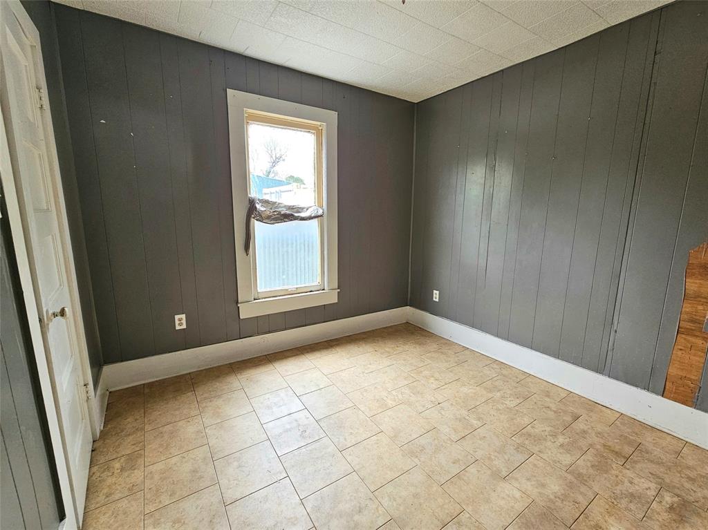 704 2nd Street Bangs, TX 76823 - Photo 5 of 10 an empty room with windows