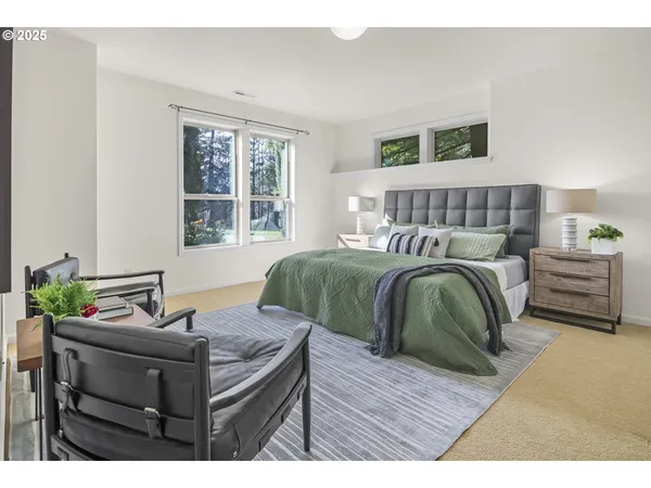 a bedroom with a bed window and a couch