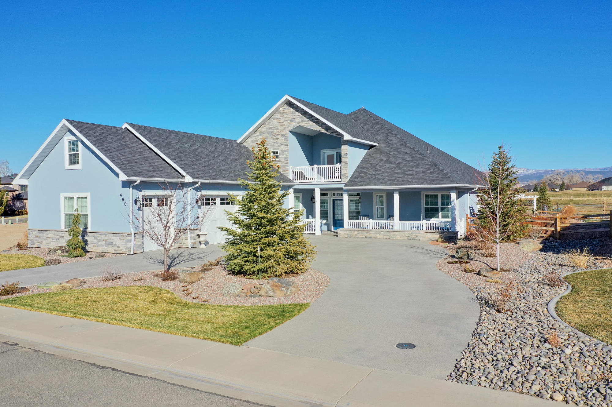 490 Cobble Drive Montrose, CO 81403 - Photo 2 of 58 a front view of a house with a yard