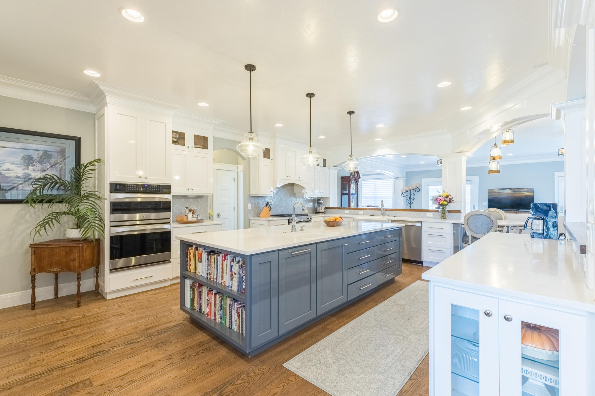 490 Cobble Drive Montrose, CO 81403 - Photo 12 of 58 a large kitchen with kitchen island a stove a sink a center island and furniture