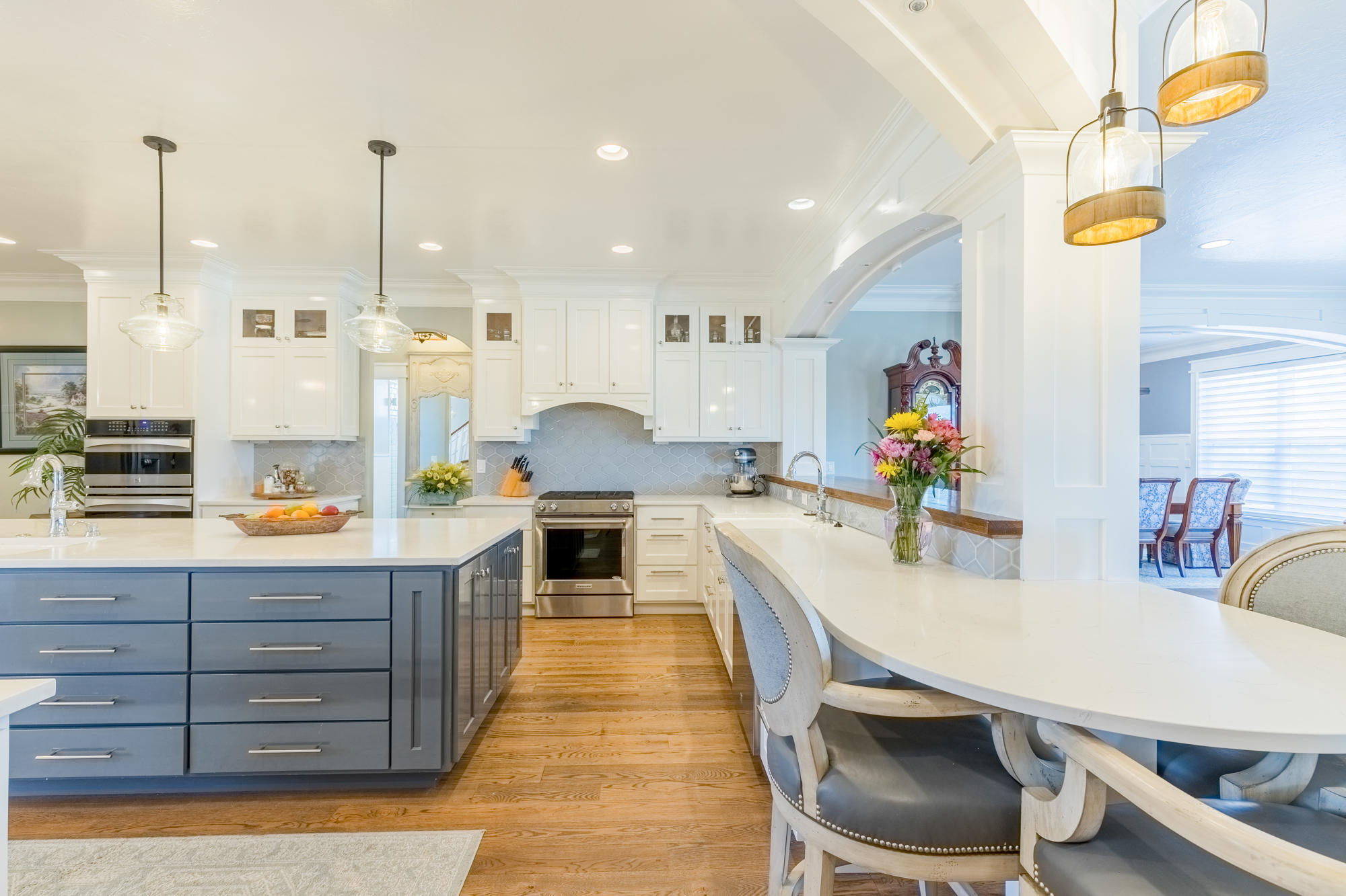 490 Cobble Drive Montrose, CO 81403 - Photo 19 of 58 a kitchen with stainless steel appliances granite countertop a sink a stove and a wooden floors