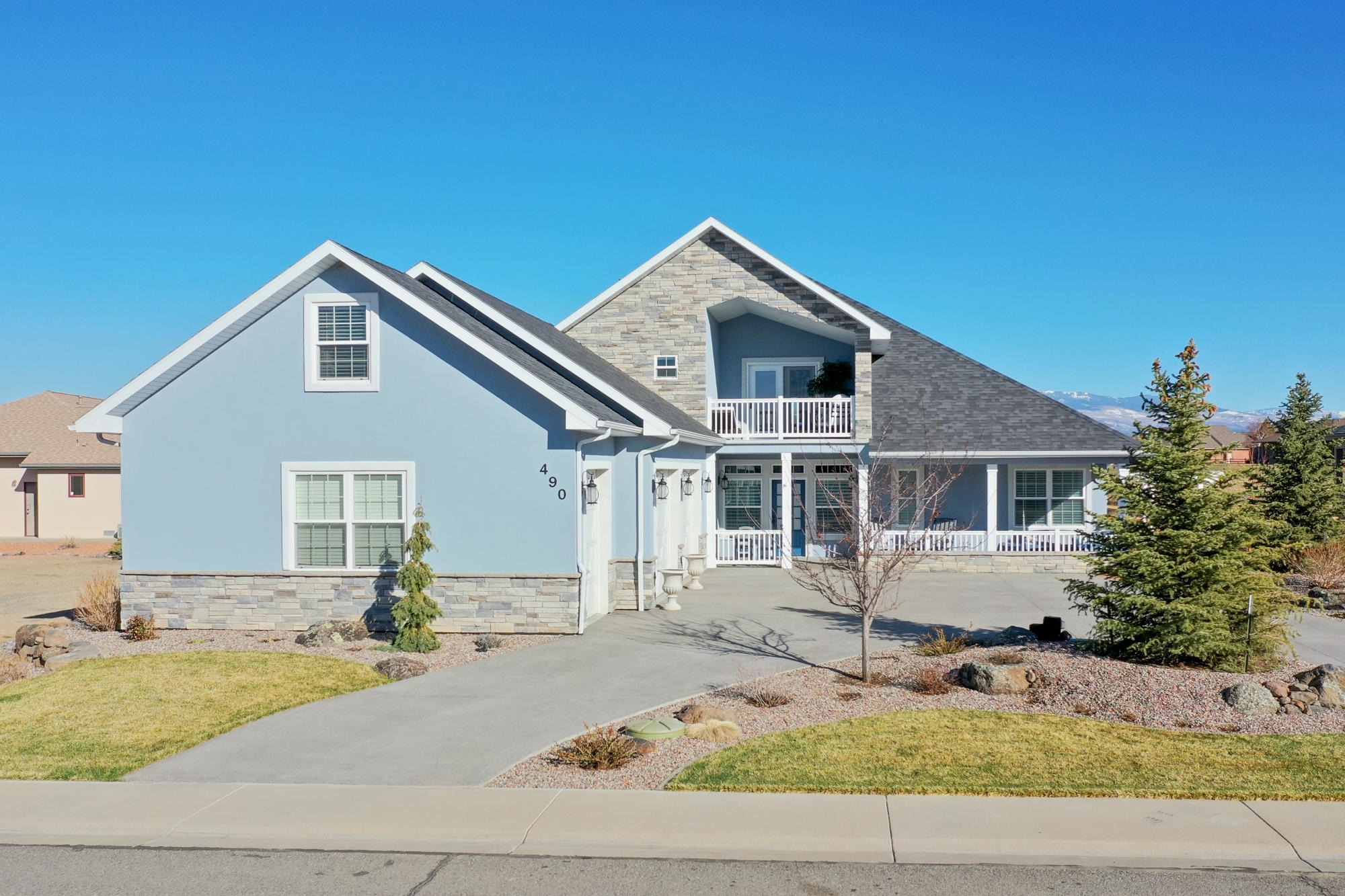 490 Cobble Drive Montrose, CO 81403 - Photo 3 of 58 a front view of house with yard