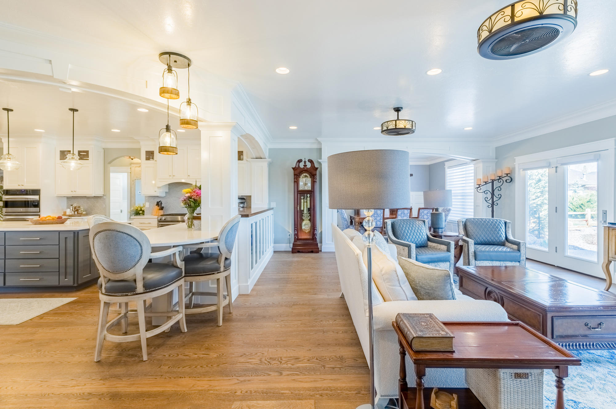 490 Cobble Drive Montrose, CO 81403 - Photo 21 of 58 a dining room with wooden floor a glass table and chairs
