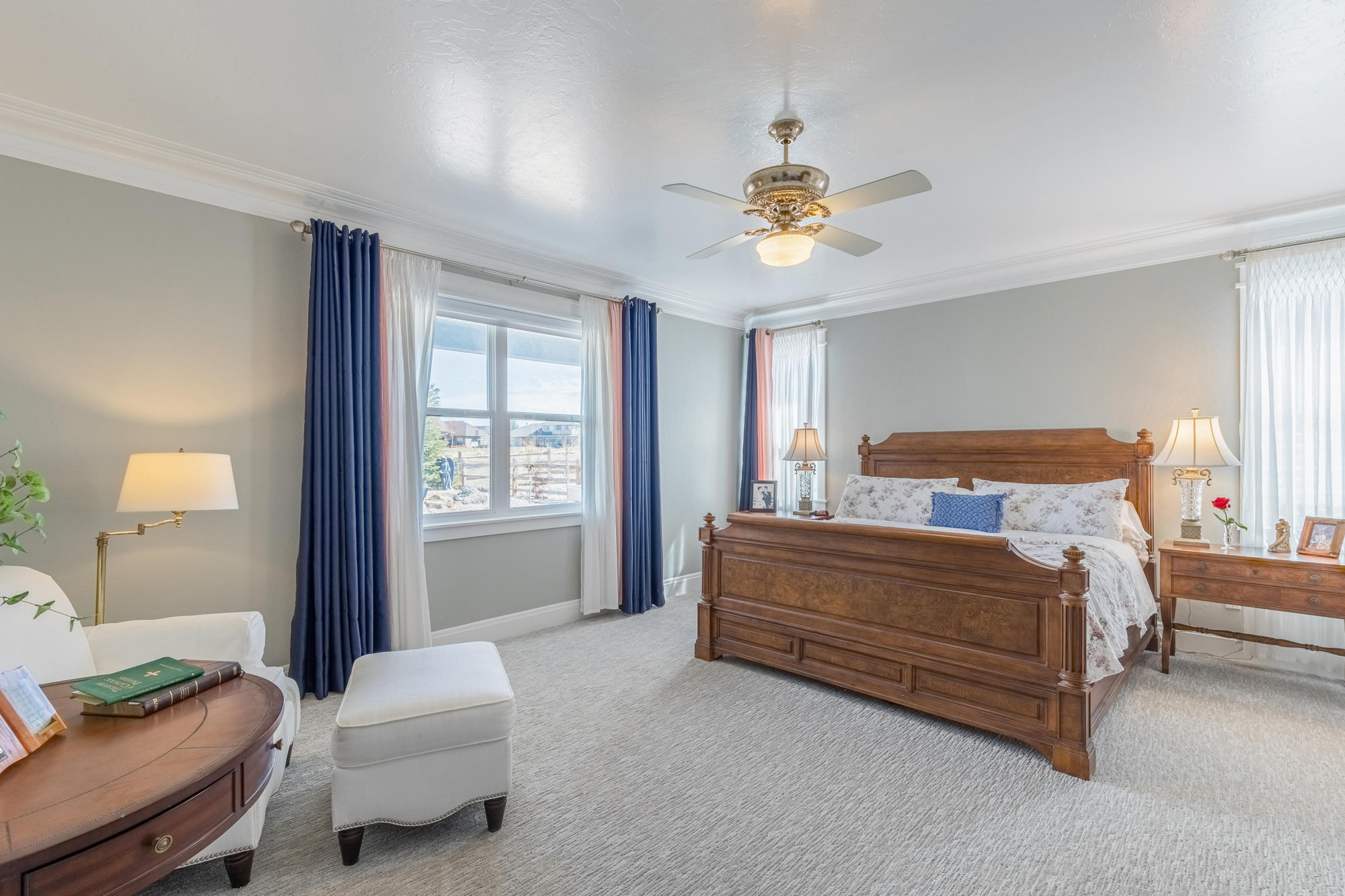 490 Cobble Drive Montrose, CO 81403 - Photo 35 of 58 a bedroom with a bed and a chandelier