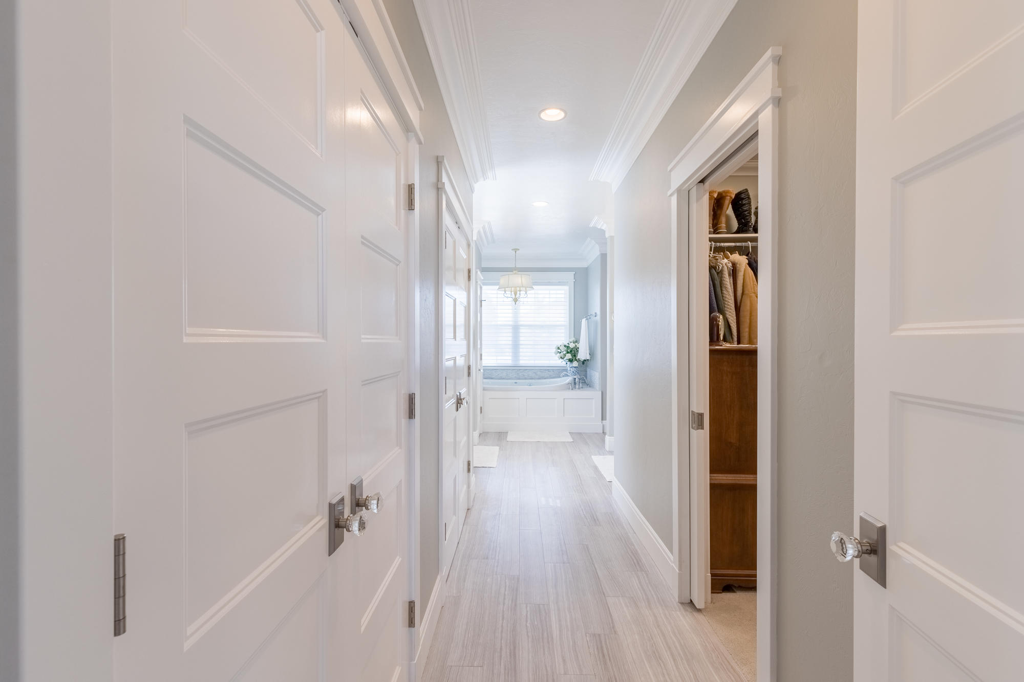 490 Cobble Drive Montrose, CO 81403 - Photo 37 of 58 a view of a hallway with wooden floor and a bathroom