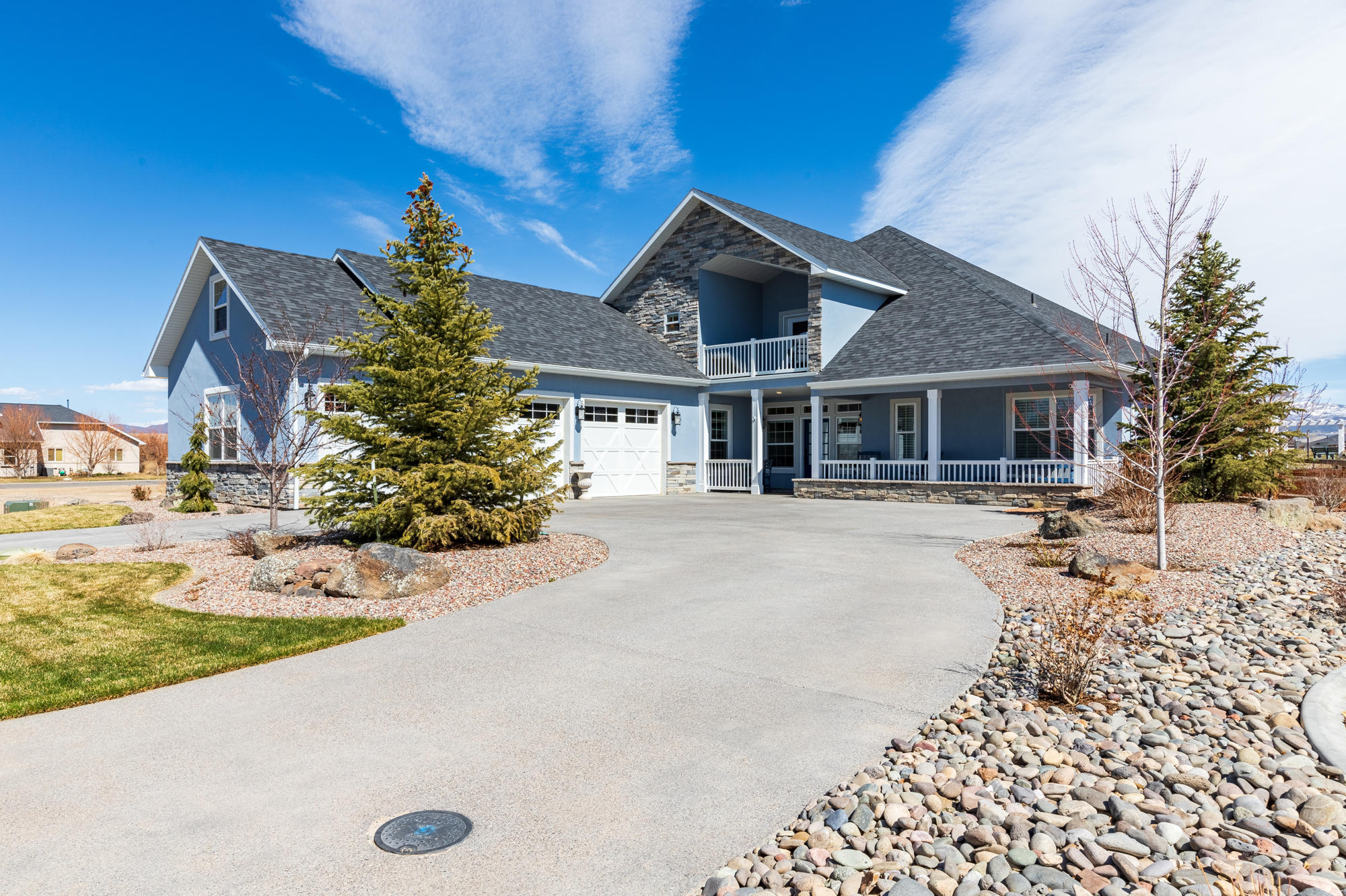 490 Cobble Drive Montrose, CO 81403 - Photo 5 of 58 a front view of a house with garden