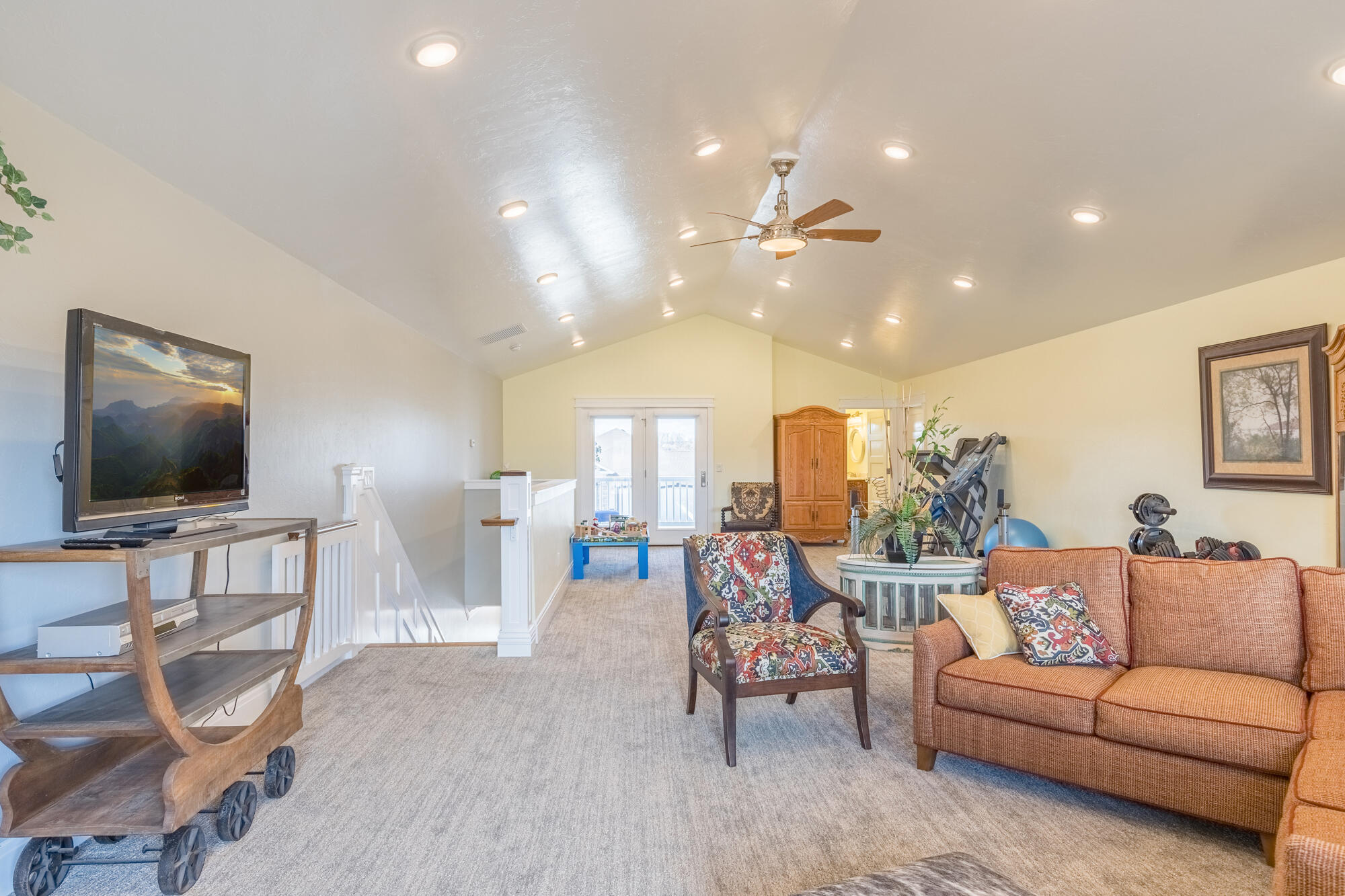 490 Cobble Drive Montrose, CO 81403 - Photo 45 of 58 a living room with furniture and a flat screen tv
