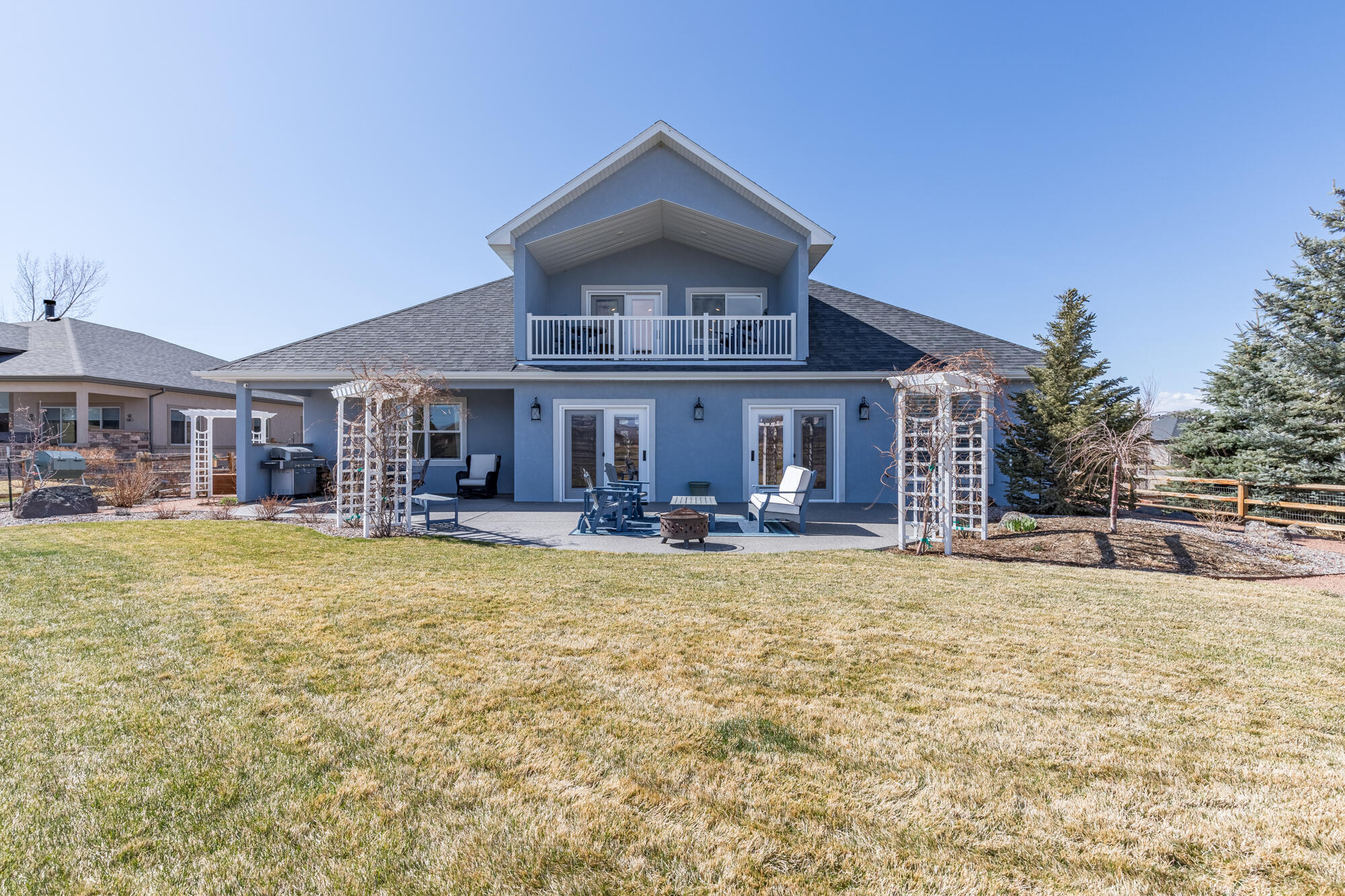 490 Cobble Drive Montrose, CO 81403 - Photo 55 of 58 a front view of a house with swimming pool having outdoor seating