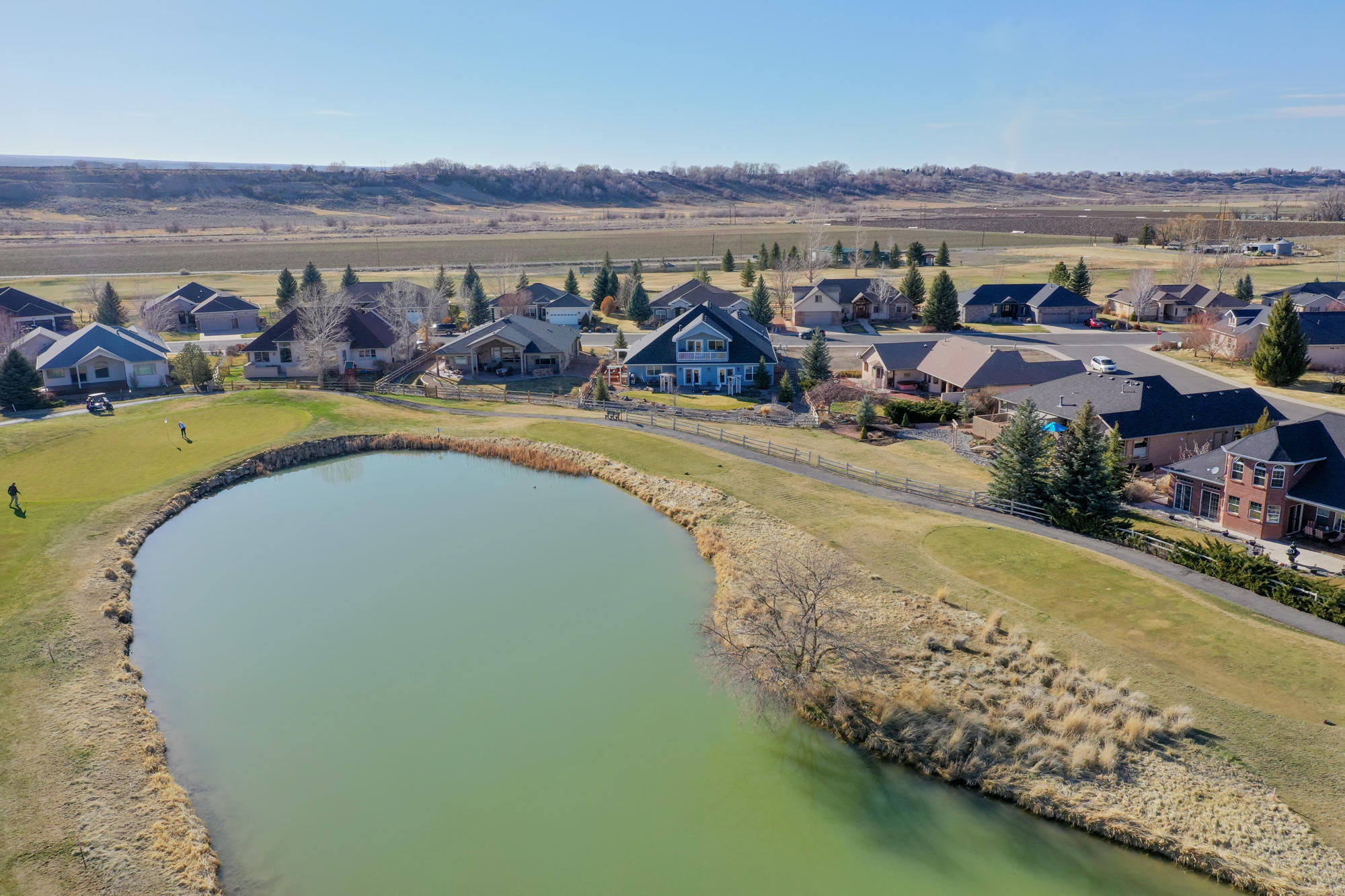 490 Cobble Drive Montrose, CO 81403 - Photo 58 of 58 aerial view of a house with outdoor space and lake view
