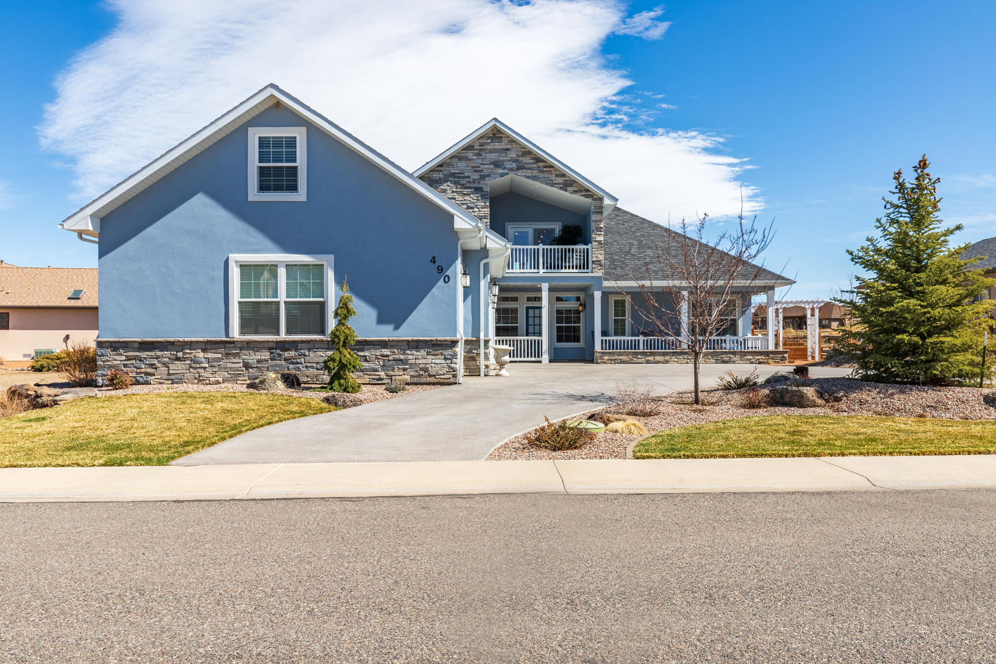 490 Cobble Drive Montrose, CO 81403 - Photo 7 of 58 a front view of a house with a yard
