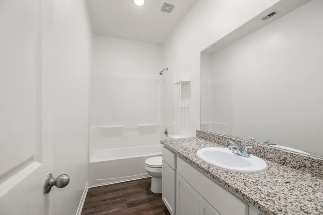 a view of empty room with windows