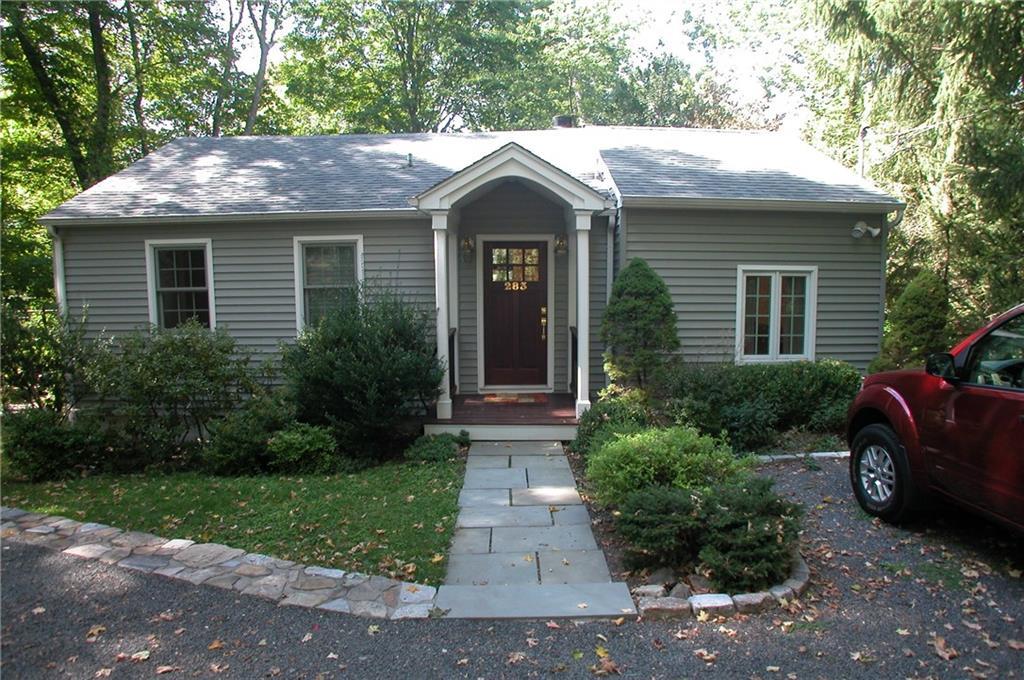 283 Great Hill Road Ridgefield, CT 06877 - Photo 1 of 1 a front view of a house with garden