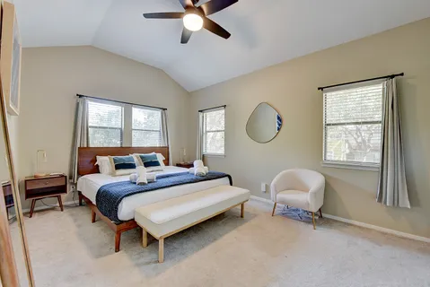 a bedroom with bed and a window