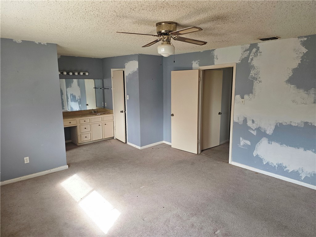 4961 Shadowbend Drive Corpus Christi, TX 78413 - Photo 11 of 16 a view of a big room with chandelier fan and windows