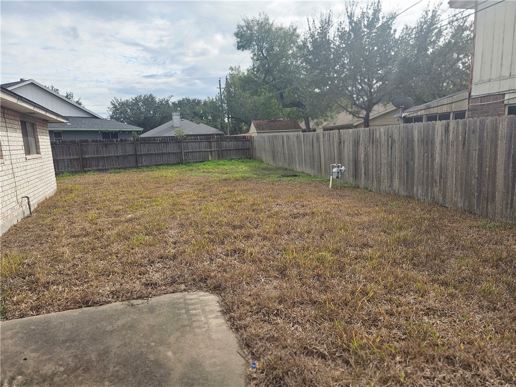 4961 Shadowbend Drive Corpus Christi, TX 78413 - Photo 5 of 16 a view of backyard with wooden fence