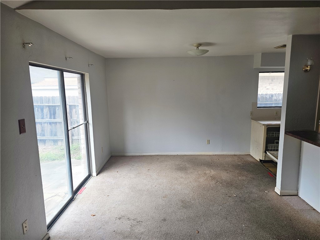 4961 Shadowbend Drive Corpus Christi, TX 78413 - Photo 8 of 16 an empty room with windows