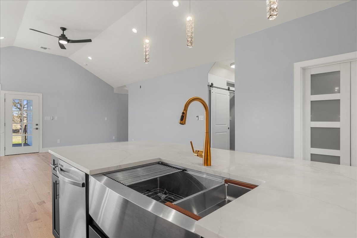 217 Gato Road Cedar Creek, TX 78612 - Photo 10 of 40 a kitchen that has a sink and a stove