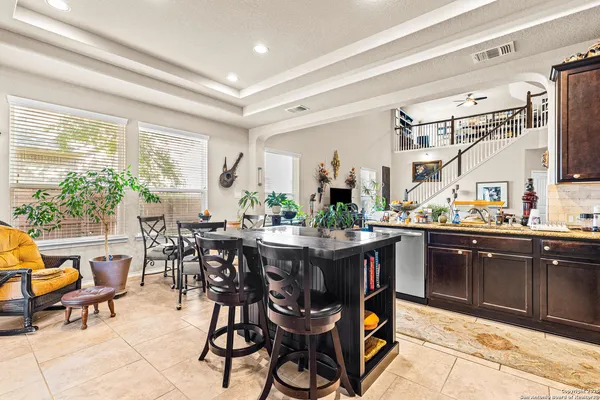 a view of a dining room and livingroom with furniture window and wooden floor