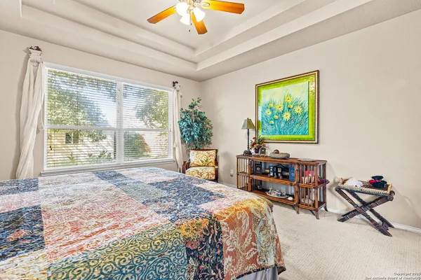 a bedroom with furniture and a window