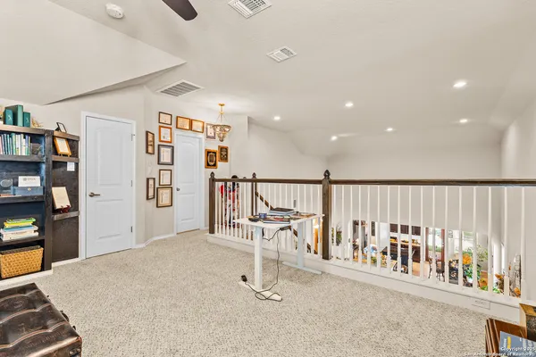 a view of a hallway with workspace