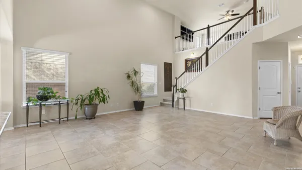 a view of an empty room with stairs