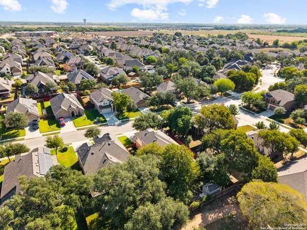 an aerial view of residential houses with outdoor space