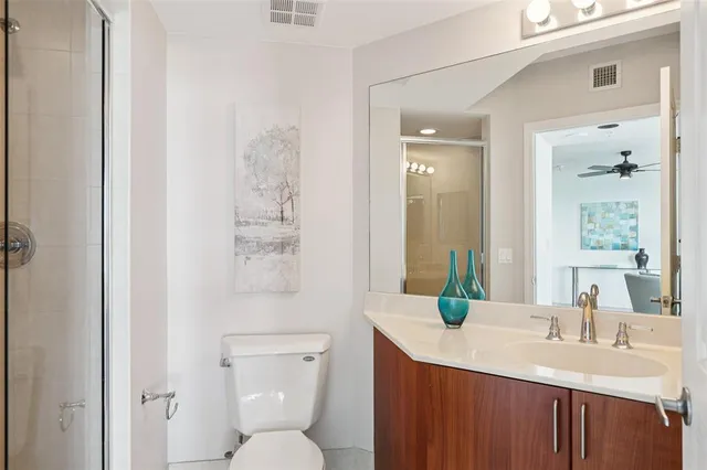 a bedroom with a large bed and a large window