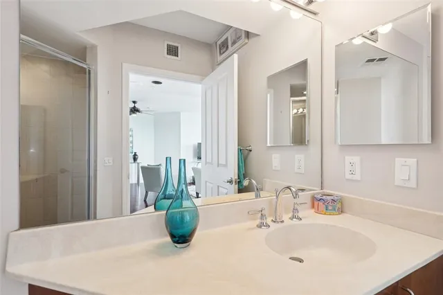 a bedroom with a large bed and a large window