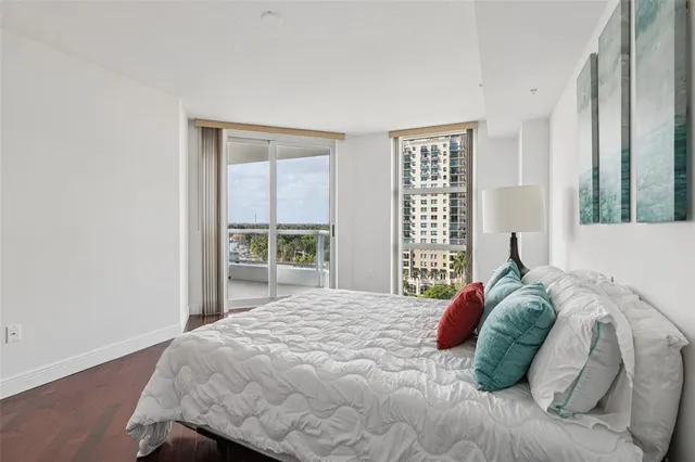 a spacious bathroom with a double vanity sink a mirror and a bathtub