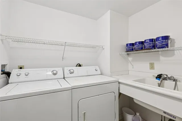 a living room with furniture a flat screen tv and a large window