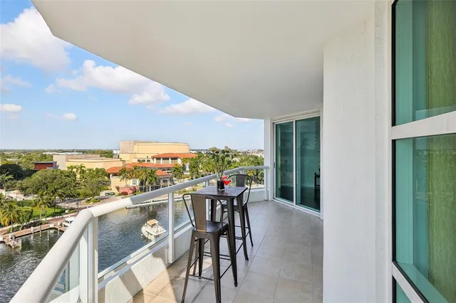 a view of a balcony with chair and table