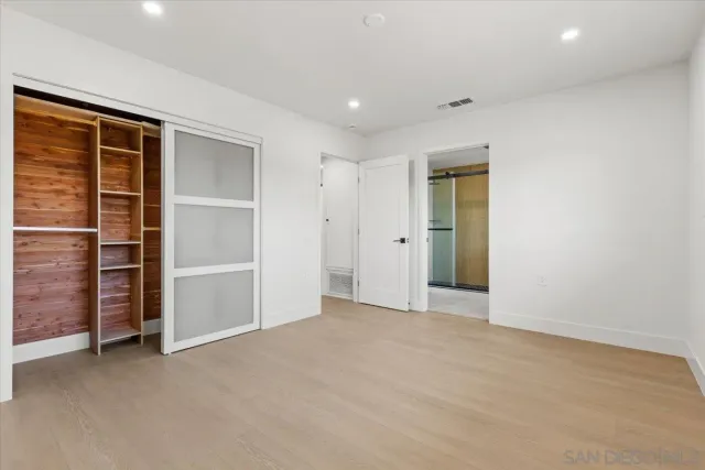 a bathroom with a shower sink and mirror