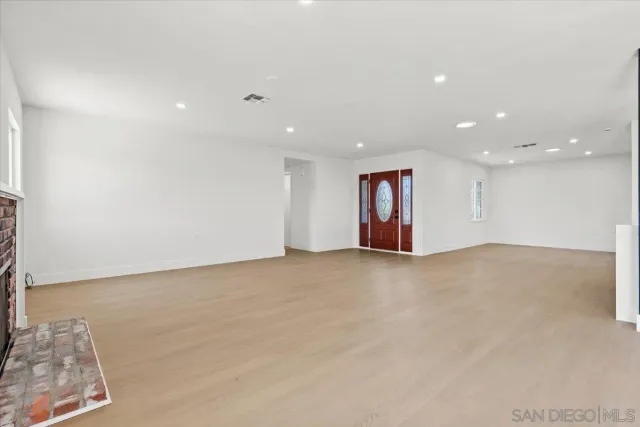 a kitchen with stainless steel appliances a refrigerator and a stove top oven