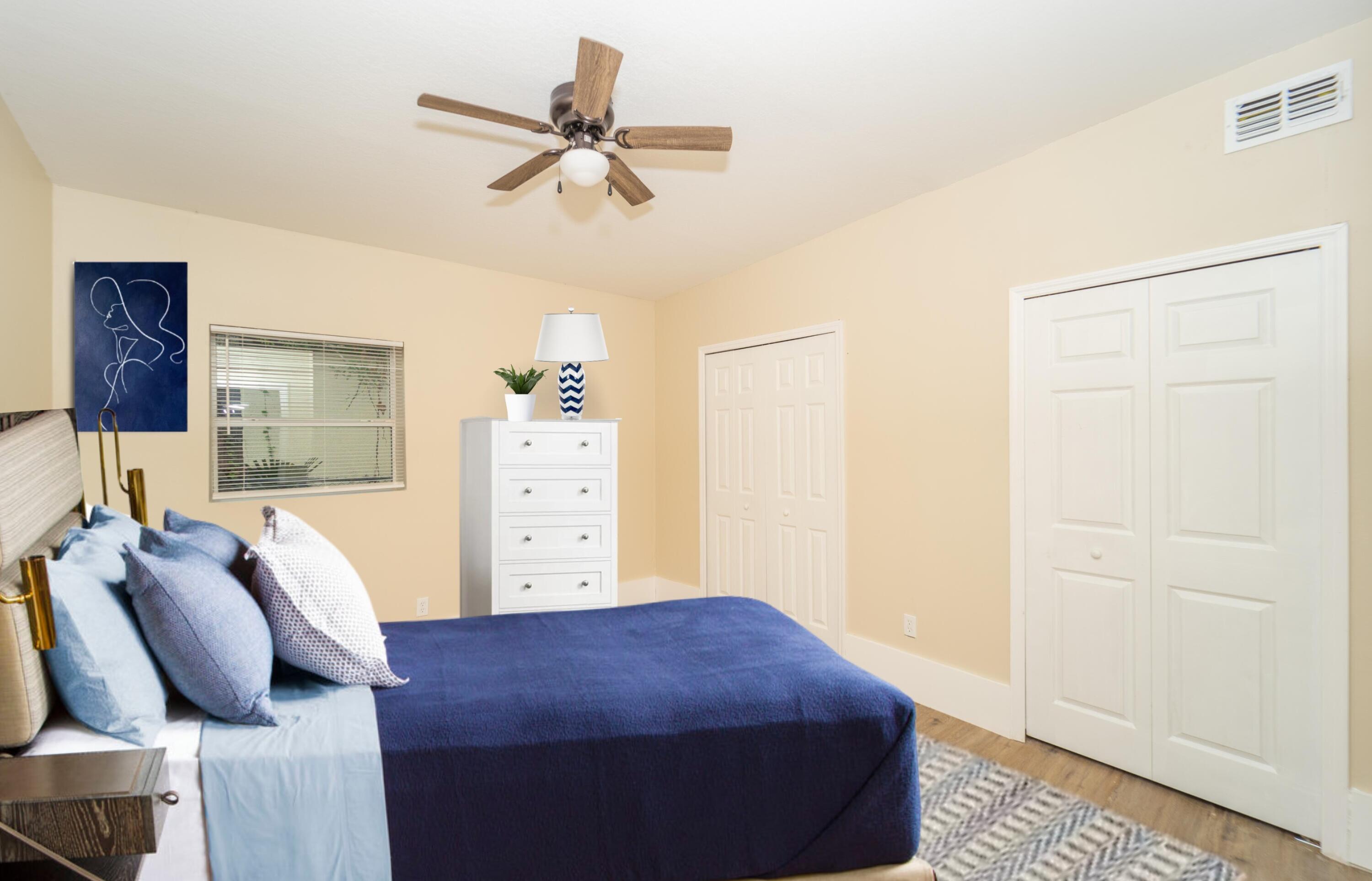 254 Lime Street Cocoa, FL 32926 - Photo 11 of 16 a bedroom with a bed and ceiling fan