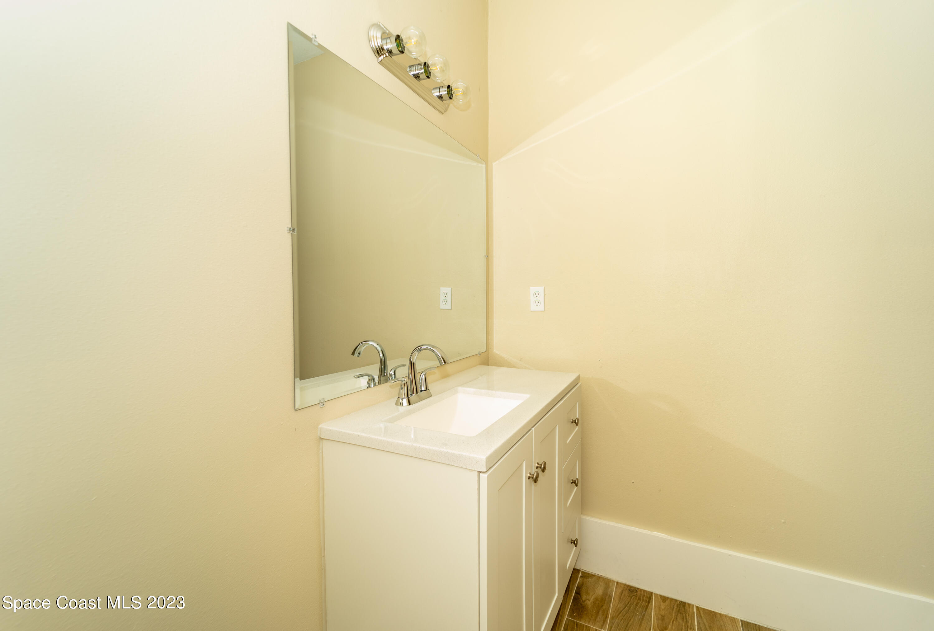 254 Lime Street Cocoa, FL 32926 - Photo 14 of 16 a bathroom with a sink and a mirror