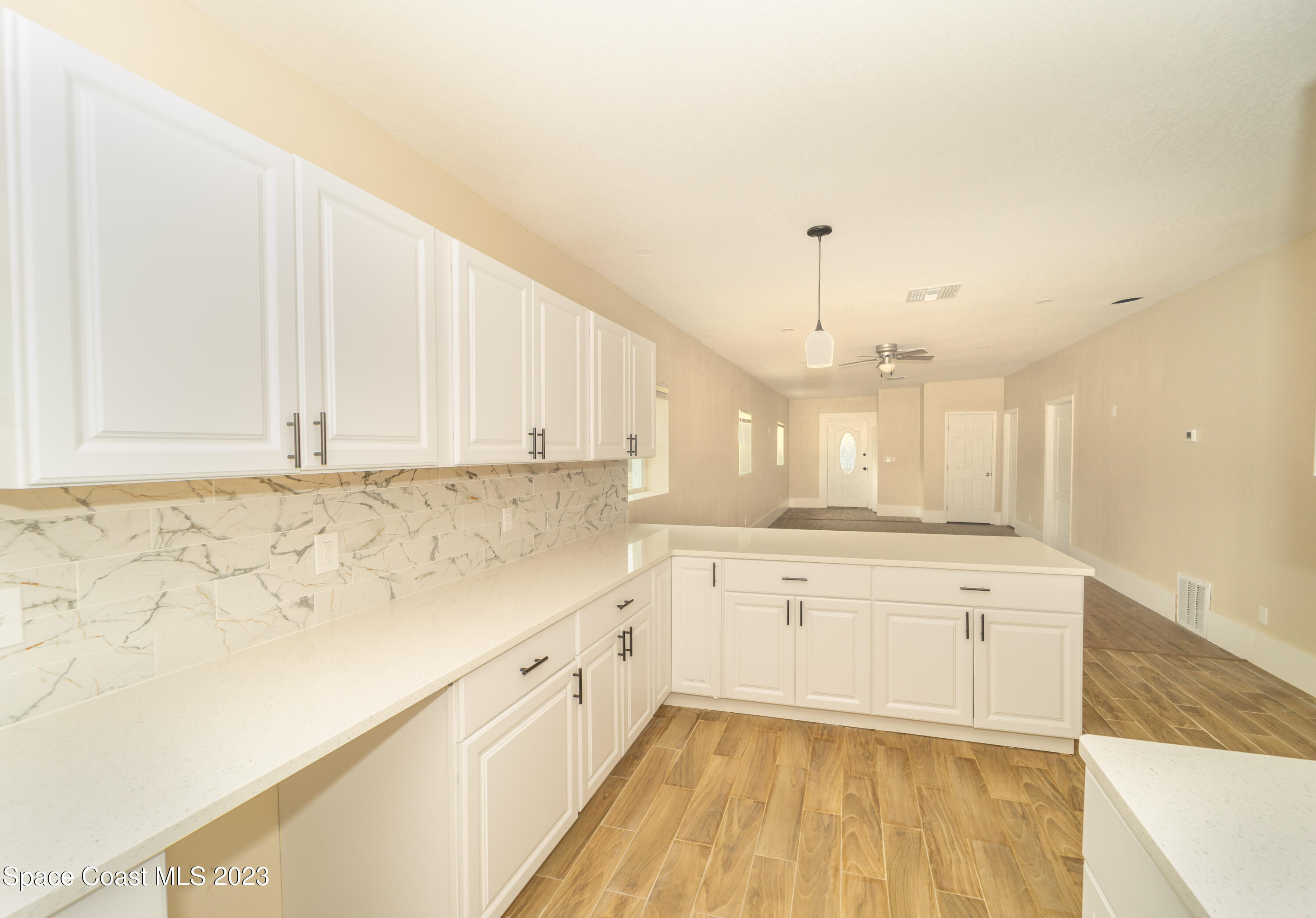 254 Lime Street Cocoa, FL 32926 - Photo 3 of 16 a view of a kitchen with wooden floor