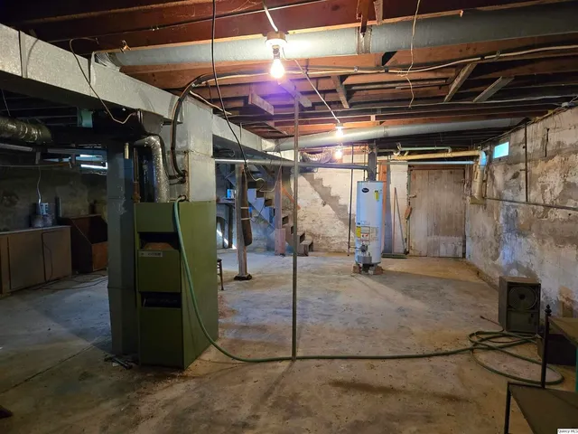 a view of yard with swimming pool and green space