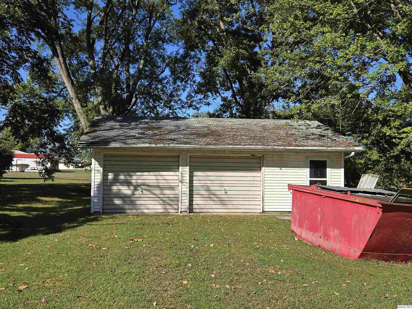401 Ravenscroft Avenue Versailles, IL 62378 - Photo 2 of 14 a view of a backyard with a garden
