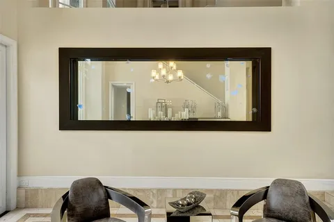 a bathroom with a sink and a large mirror