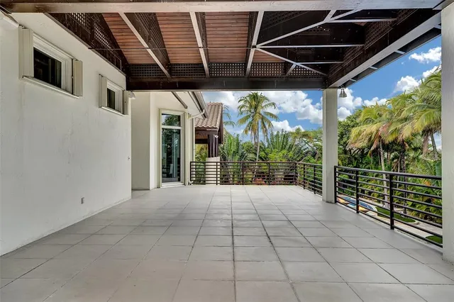 a swimming pool with outdoor seating and yard