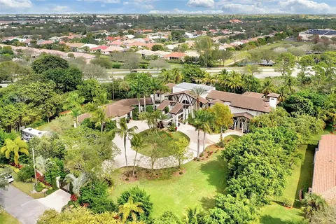 an aerial view of a house with a garden and plants