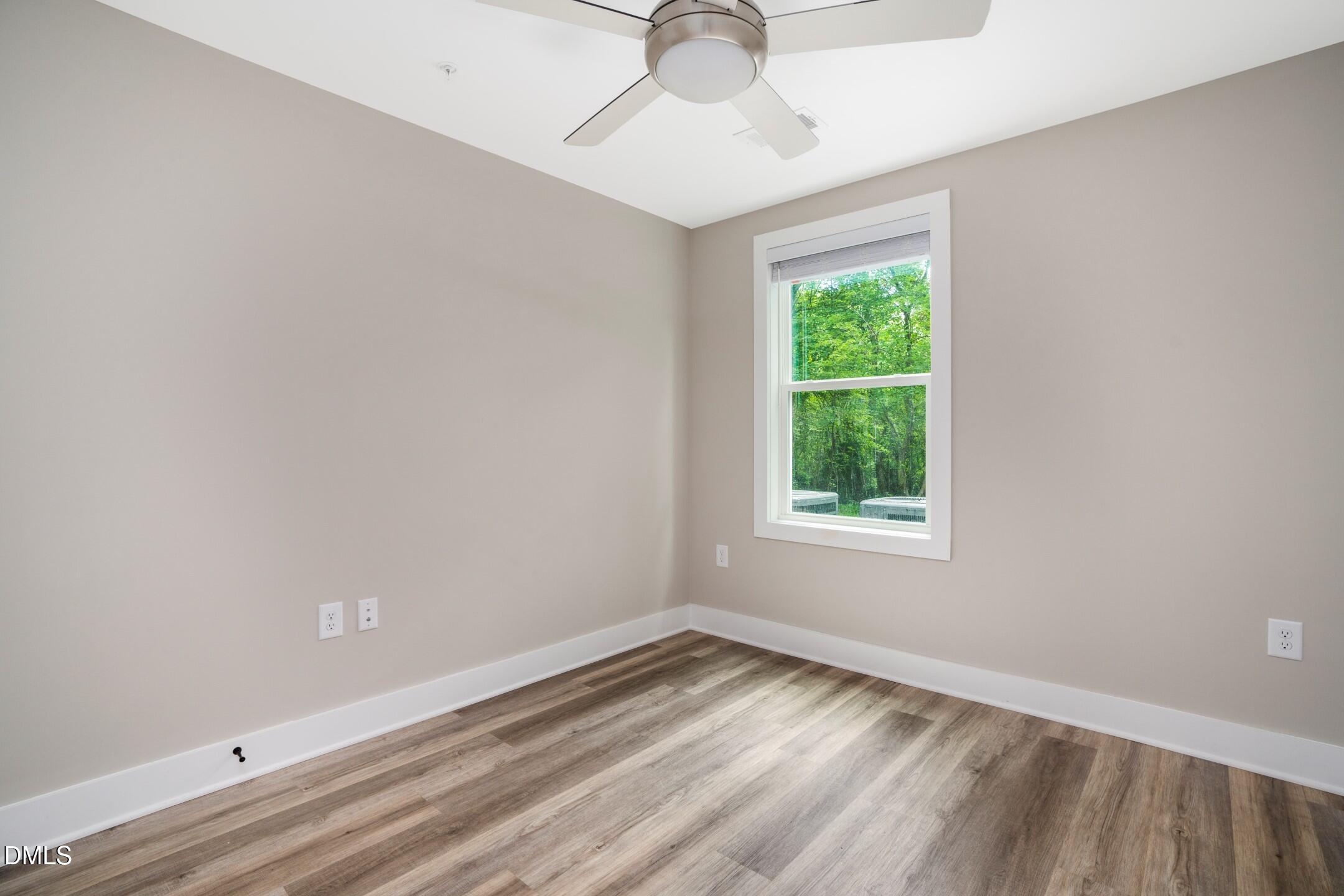 303 Linwood Street, Unit 302 Apex, NC 27502 - Photo 7 of 19 an empty room with a window