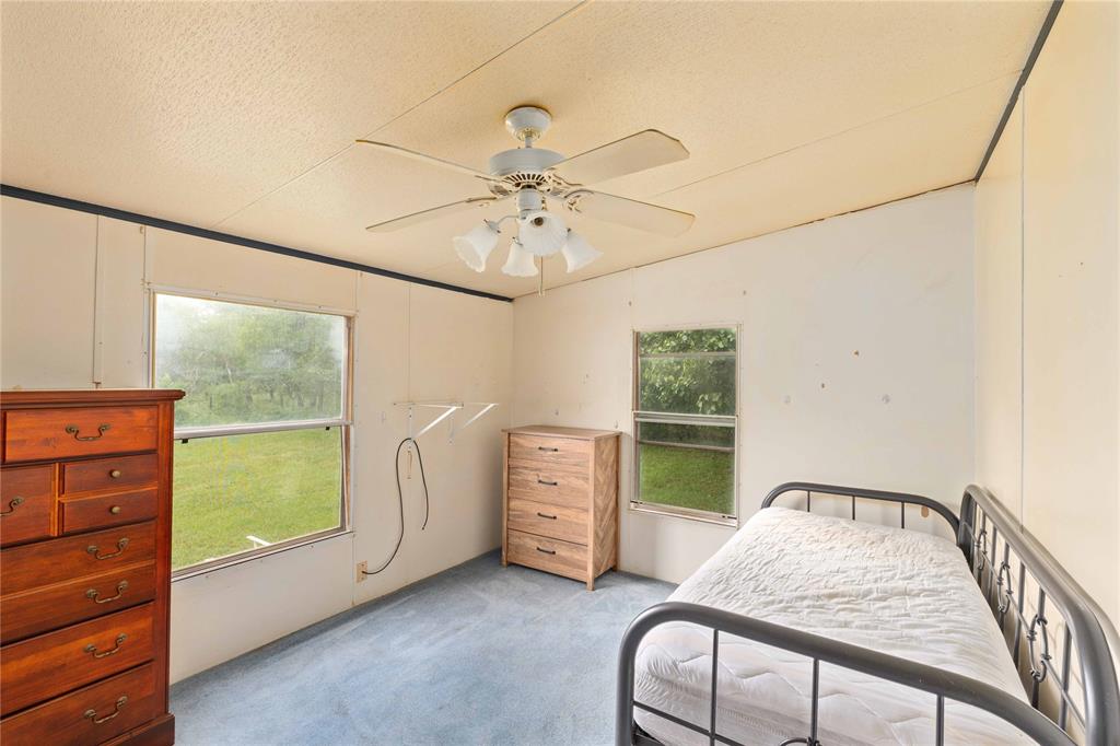 210 7th Street Blanket, TX 76432 - Photo 16 of 33 a bedroom with a bed and a window