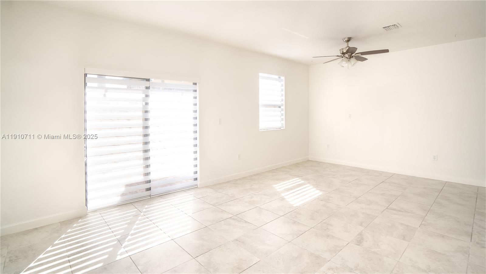 11374 Southwest 254th Terrace Homestead, FL 33032 - Photo 13 of 51 a view of a room that has a window in it
